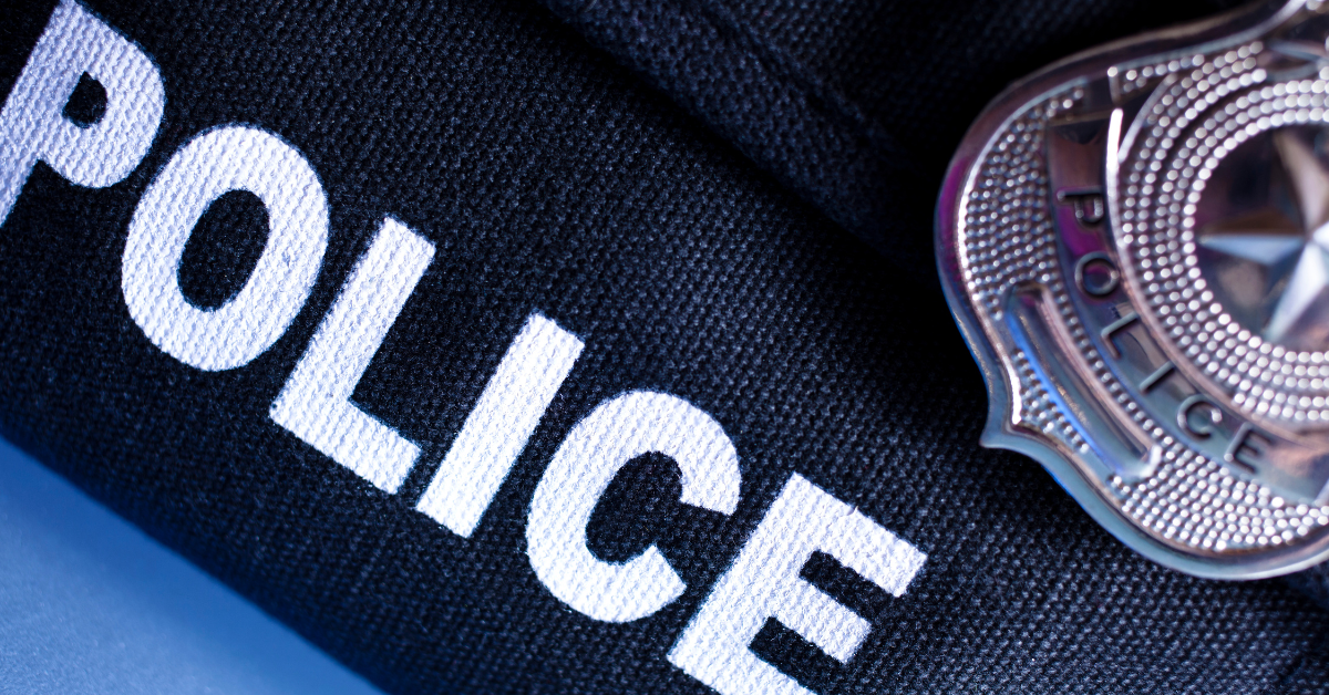 a police badge on the uniform
