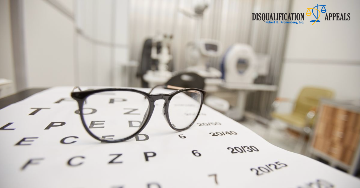 Eyeglasses on an eye chart in an exam room for NYPD vision requirements